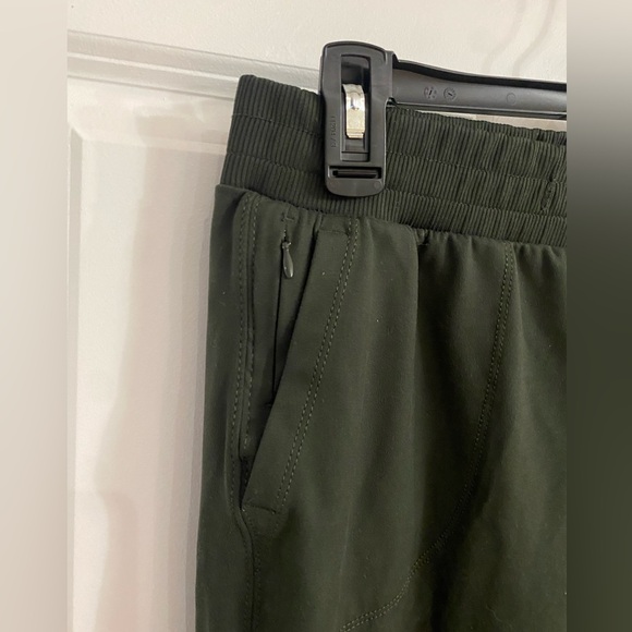 Green joggers with pockets and zipper. Size medium. - Picture 3 of 4